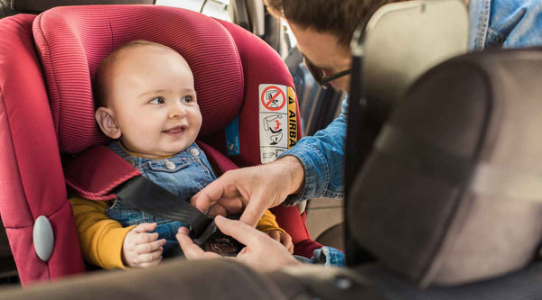 Baby buckled in car seat