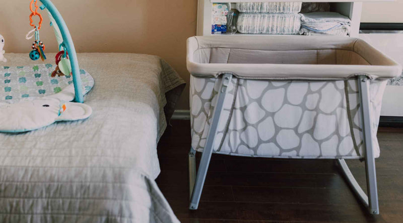 Baby crib near bed