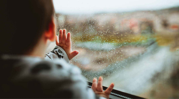 baby looking through the window