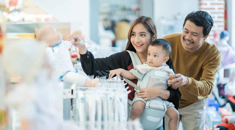 Mom and dad shopping with baby