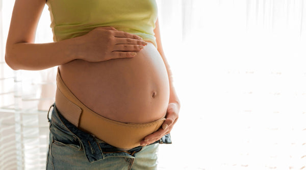 pregnant woman with support belt